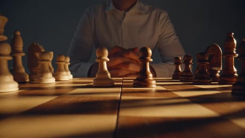 Unknown Chess Player Sitting Chessboard Zoom on Gamer Pondering Move Thinking