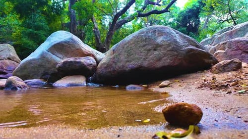 Water Flowing Between The Rocks