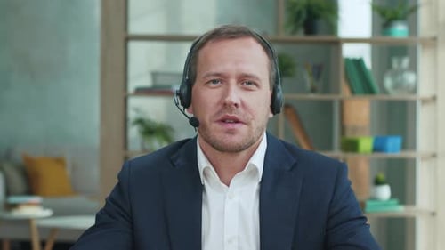 Adult Businessman Talking On Video Conference In Online Office. Handsome Manager Having Call With...