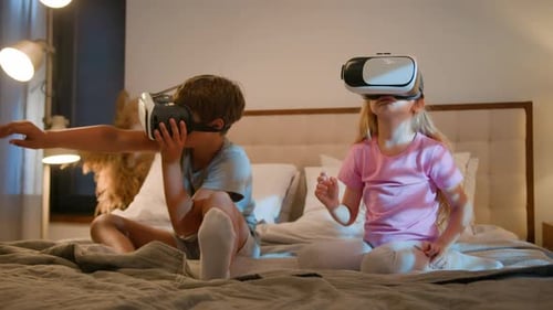 Children Wearing VR Headsets in Bedroom