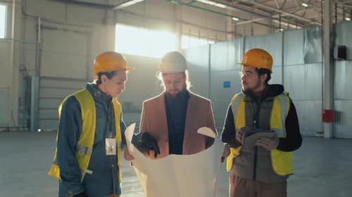 Building Owner and Engineers Negotiating Plan Implementation