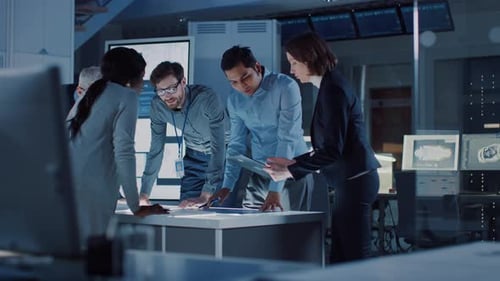 Diverse Team Collaborating Around Table in Modern Office