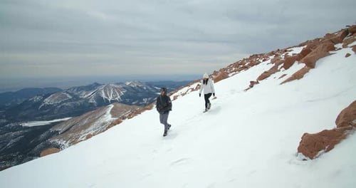 Couple Hiking Summit of Rocky Mountains, Climbing, Hiking Peak Adventure