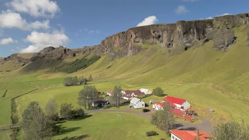 Aerial View Scenic Icelandic Road Snaking Through Lush Hills Drone Footage