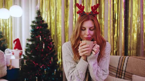 Woman Smiling with Mug at Christmas Time