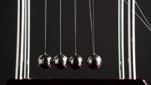 Newtons Cradle Demonstrates Momentum