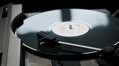 Black Vinyl Record Spinning on Vintage Turntable
