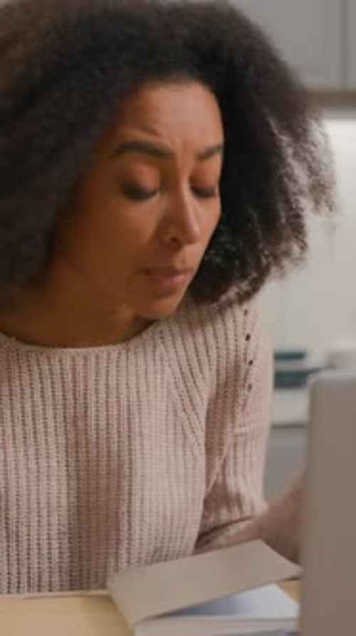 Woman Attending a Virtual Meeting At Home