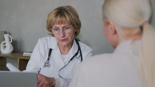 Doctor Consulting with Patient in Modern Office