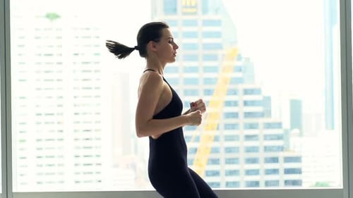 Young Woman Doing Warmup, Running by Window in Gym, Super