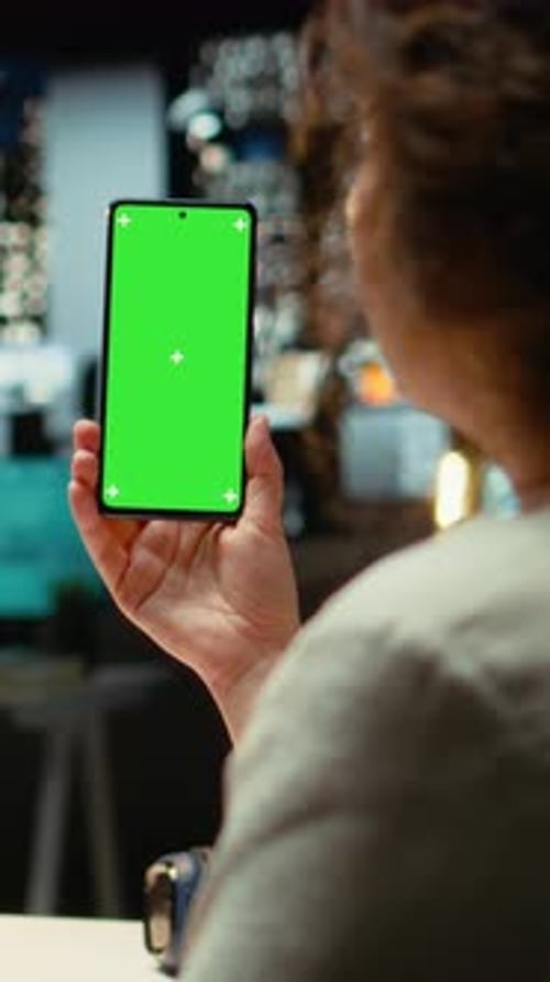 Vertical Video Office Worker Holding Her Smartphone with Chroma Key Screen at Desk