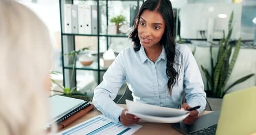 Women Discussing Business in Modern Office Workplace