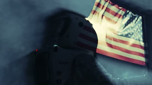 Astronaut Standing with American Flag on Distant Planet