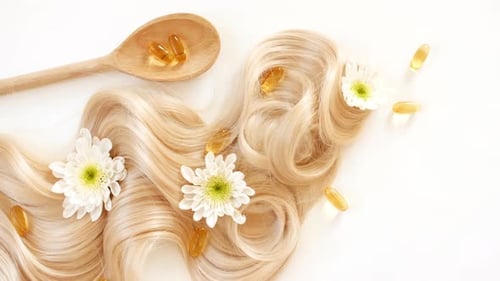 Blonde Hair, Daisies, and Hair Supplement Capsules