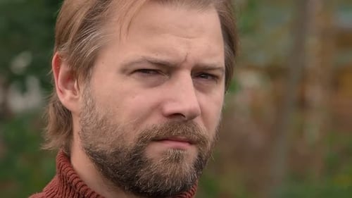 Close Up of Bearded Man in Nature Setting
