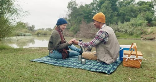 Toast, coffee and couple in a forest for picnic, celebration or romantic holiday in nature together