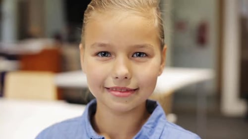 Smiling Girl Looking Directly at Camera Indoors