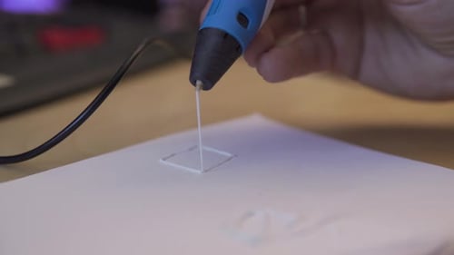 Static view of drawing with 3d pen in three dimensions.