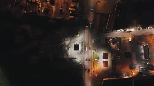 Aerial Nighttime View of City Street and Buildings