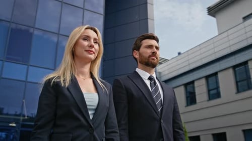 Confident Business Professionals Standing Outside Corporate Building Closeup