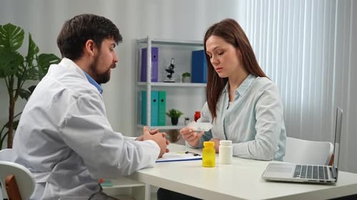 Doctor and Patient Discussing Medical Diagnosis in Office