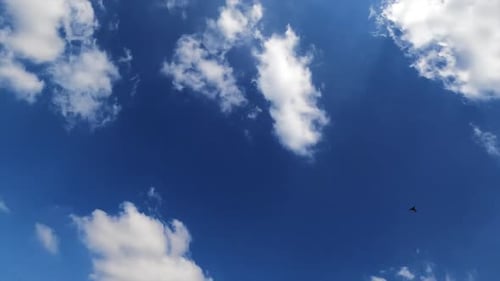 Fluffy white clouds building in the sky
