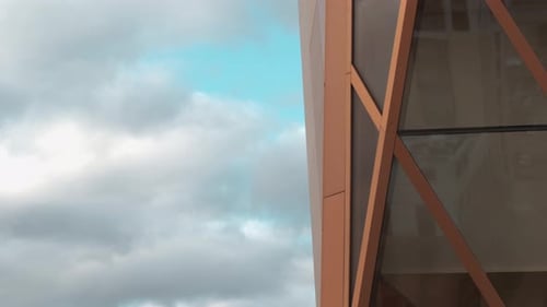 Stylish architecture of modern building with reflection and blue sky