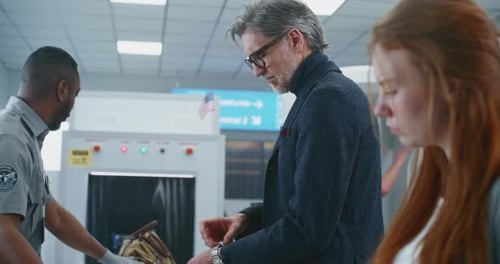 Airport Terminal Diverse Travelers Putting Personal Items Bags for Metal Detector Xray Scanning
