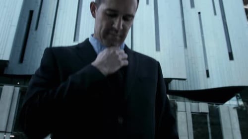 Suits Business Man Fixing His Tie Before a Deal in the City