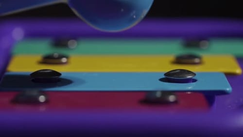 Macro Shot Of A Childs Xylophone Being Played, Musical Instrument In Slow Motion