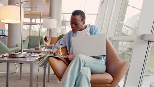 Busy Black Girl Student Using Laptop Elearning Sitting in Chair in University