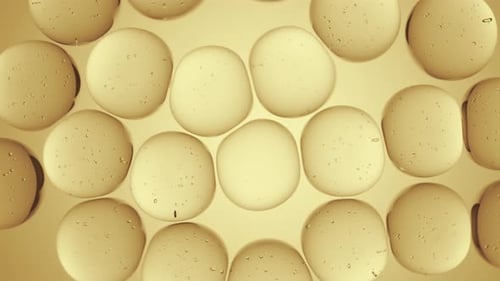 Abstract Golden Liquid Spheres Forming Grid Background