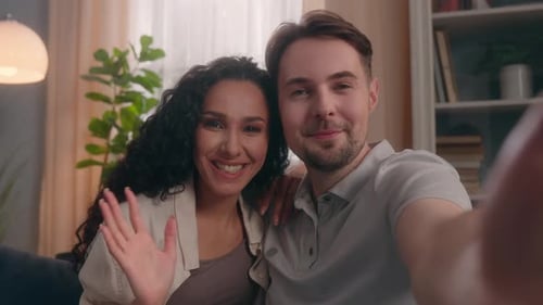 Smiling Couple Video Chatting From Home Together