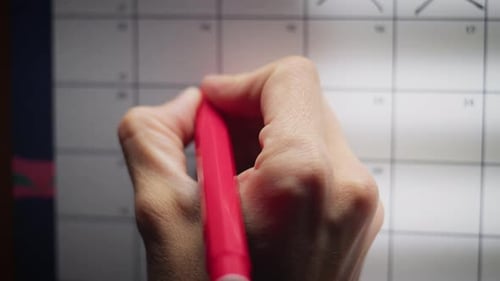 Red Marker Circles Dates on Calendar