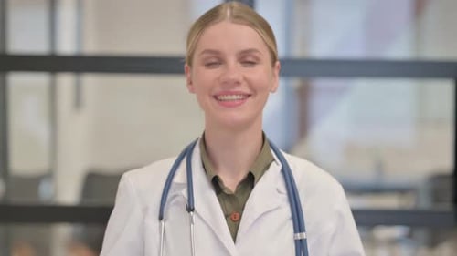 Portrait of Smiling Lady Doctor Looking at Camera