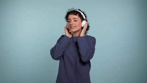 Woman Enjoying Music on Wireless Headphones