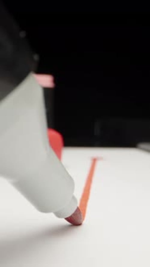 Close Up of Red Marker Drawing Line