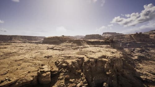 Dramatic Sundrenched Canyon Featuring Rugged Rocks and Expansive Mesas