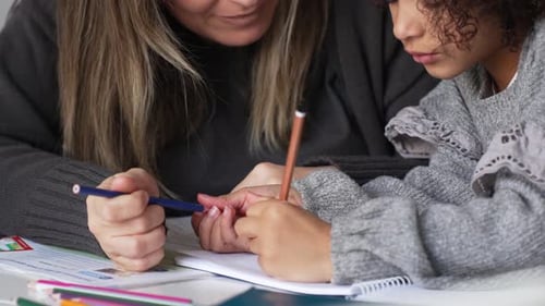 Adult Helping Child with Homework