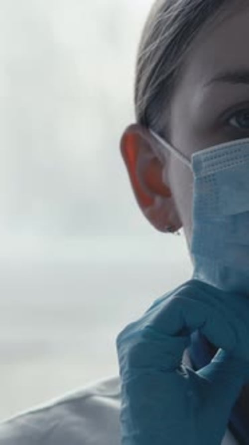 Woman Doctor Wearing Mask and Safety Goggles