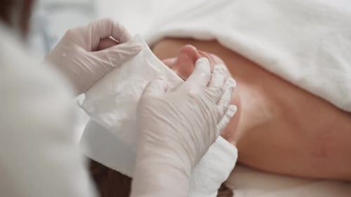 Adult Female Getting Facial Treatment in Medical Spa