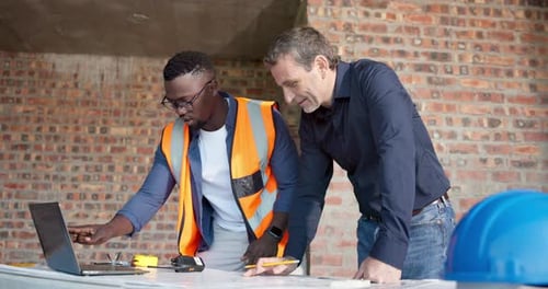 People, engineer and laptop at site with document, blueprint and research for building design