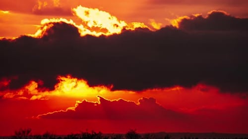 Dramatic Sunset with Dark Clouds and Golden Light