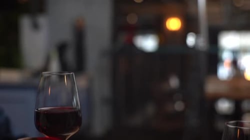 Three Friends Toasting with Wine at Night