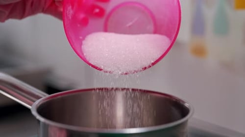 Cook Chef Pours White Granulated Sugar Into Saucepan Prepares Syrup for Cake