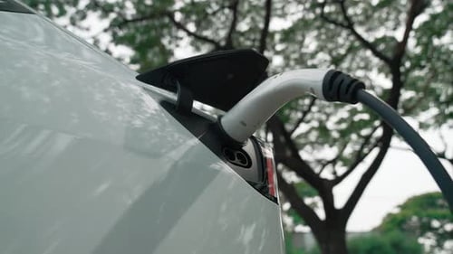 EV electric vehicle recharging battery in national park. Exalt