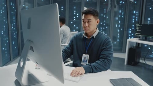 Chinese Asian Millennial Adult Office Manager Programming Software Servers in Data Center