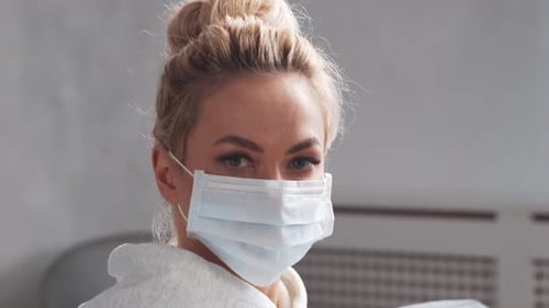 Woman Wearing Protective Face Mask Indoors