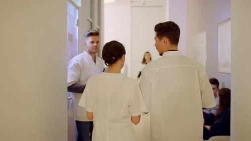 Medical Staff Walking in Hospital Hallway