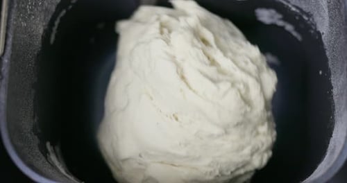 Dough Being Mixed in a Bread Machine